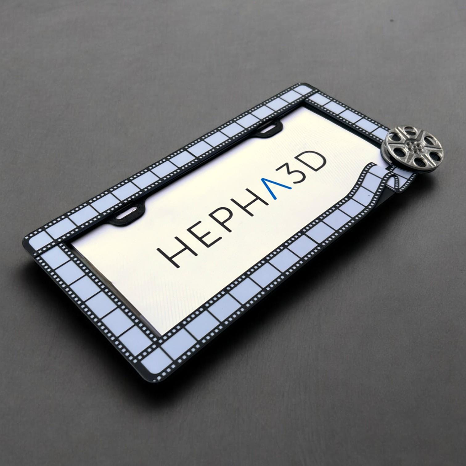 Filmmaker x PopPlates — 3D printed original license plate frame with film strip and clapperboard details, made in Vancouver BC