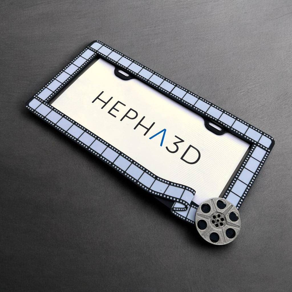 Filmmaker x PopPlates — 3D printed original license plate frame with film strip and clapperboard details, made in Vancouver BC