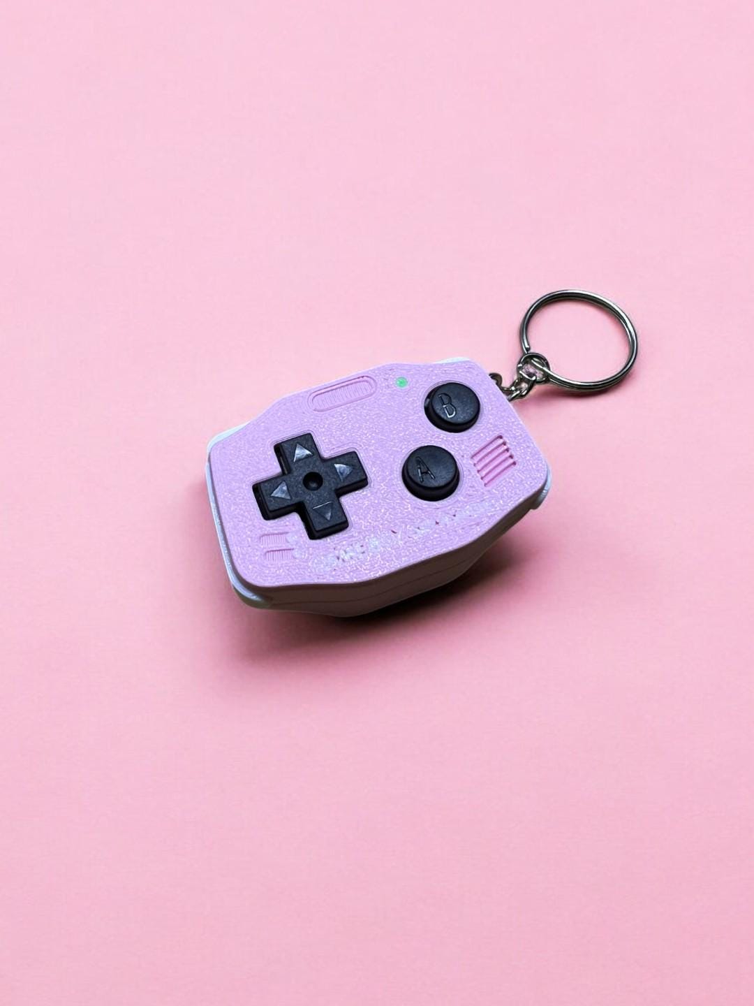 GBA-inspired AirTag holder Fidget toy in cutesy pink