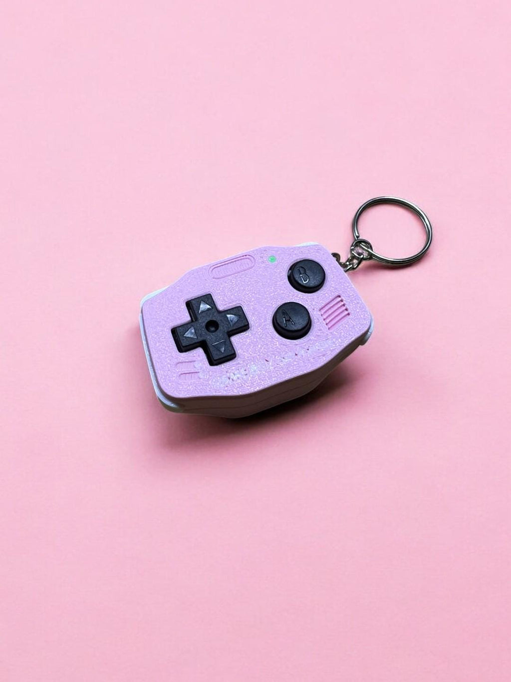 GBA-inspired AirTag holder Fidget toy in cutesy pink