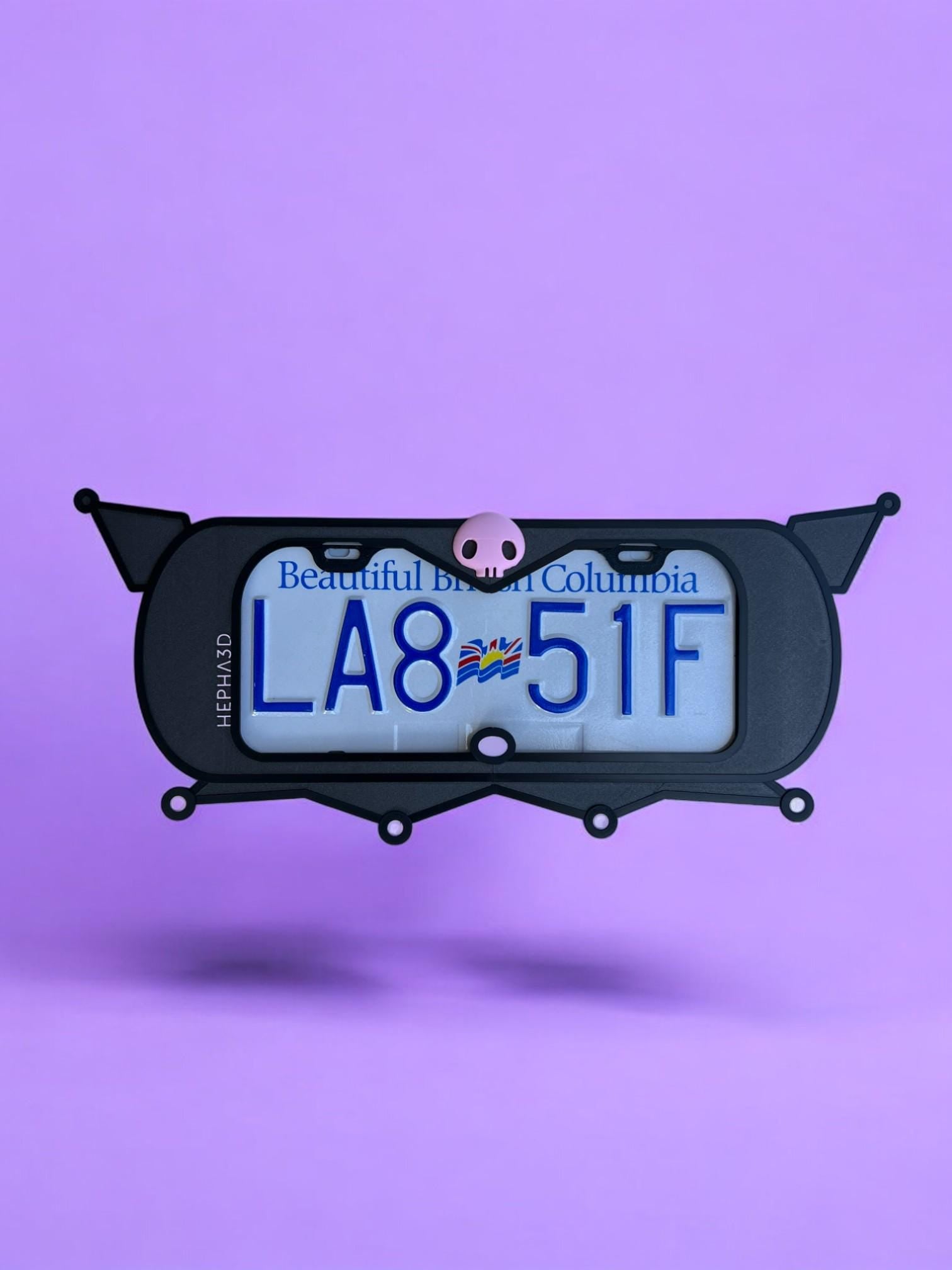 Kuromi x PopPlates — 3D printed gothic-kawaii license plate frame with pointed cat ears and pink skull accent, made in Vancouver BC