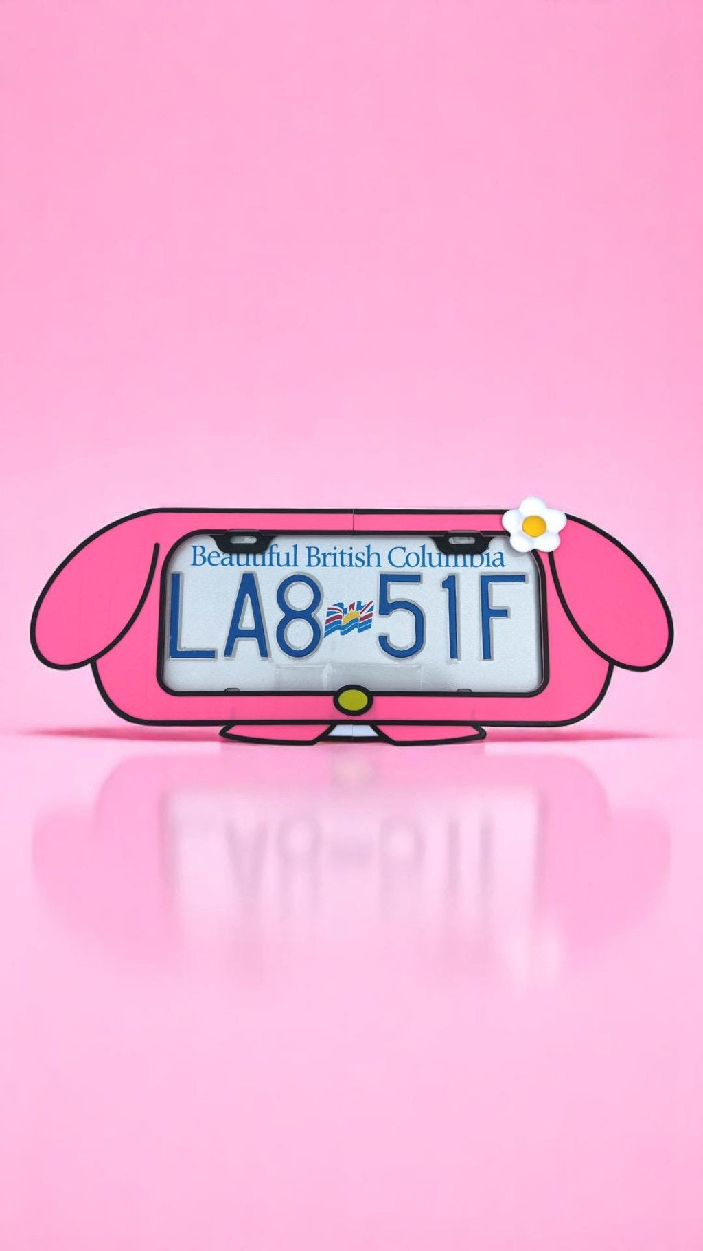My Melody x PopPlates — 3D printed kawaii Sanrio-inspired license plate frame with hood and flower details, made in Vancouver BC