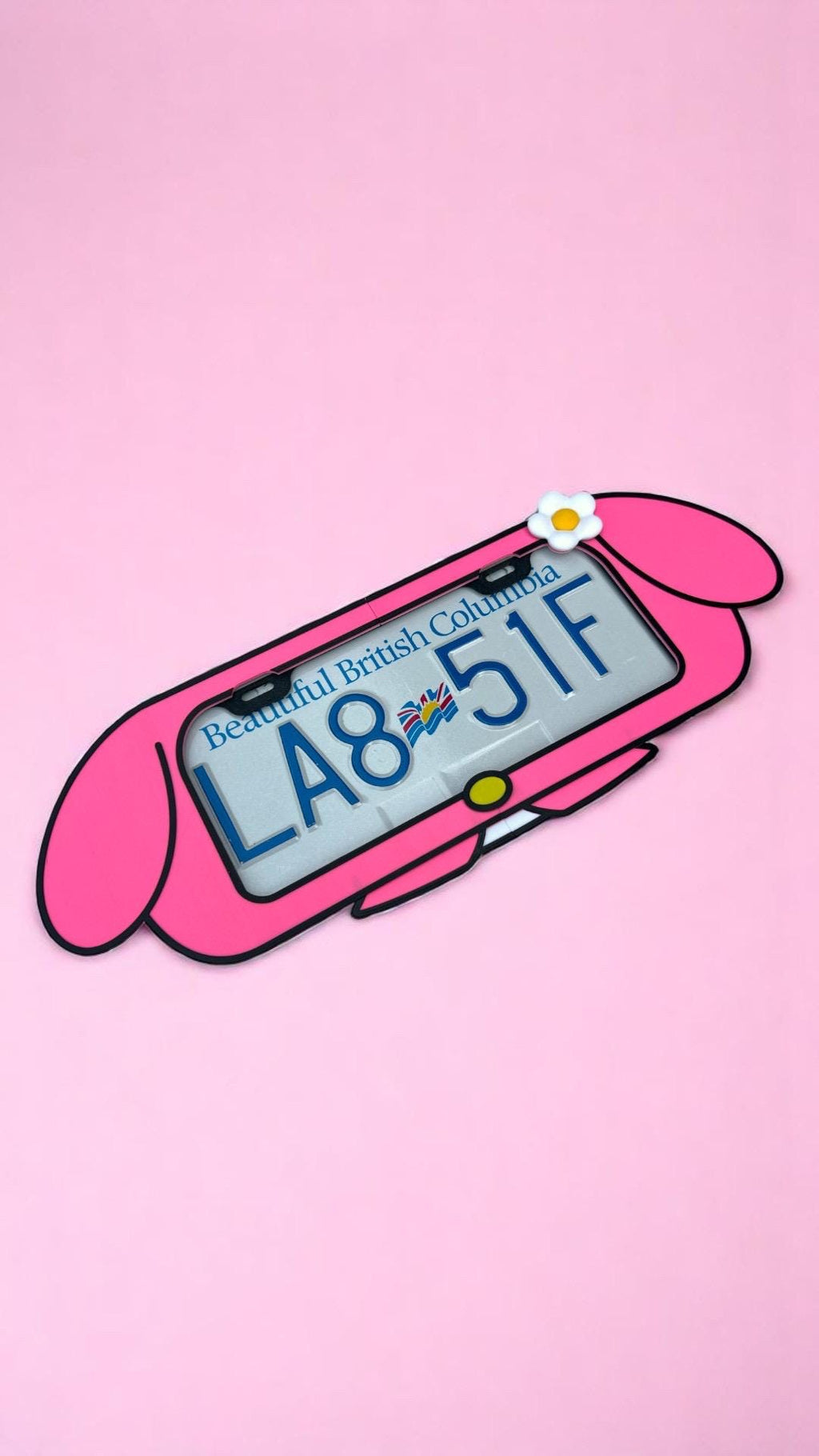 My Melody x PopPlates — 3D printed kawaii Sanrio-inspired license plate frame with hood and flower details, made in Vancouver BC