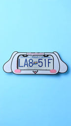 Cinnamoroll x PopPlates — extra-wide 3D printed kawaii license plate frame featuring Cinnamoroll's floppy ears and cloud details, made in Vancouver BC